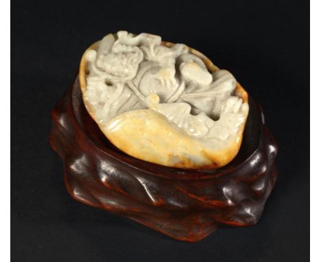 A  CHINESE JADE PEBBLE CARVING OF AN IMMORTAL AND BAT, THE REVERSE WITH RUSSET OCHRE SURFACE 7.5cm approx, with a wood stand 