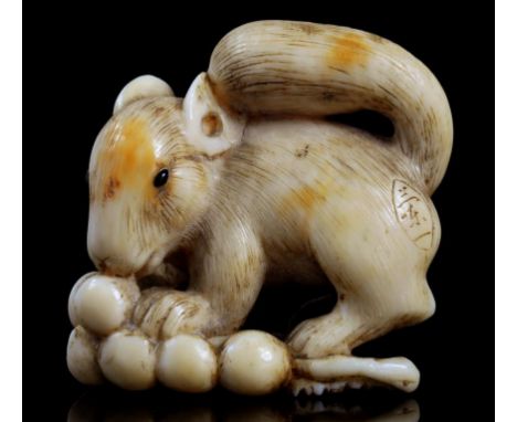 A JAPANESE IVORY NETSUKE OF A SQUIRREL, SIGNED RANICHI, KYOTO SCHOOL, EDO PERIOD, 1780-1800  the eyes inlaid, 3.1cm h For a n