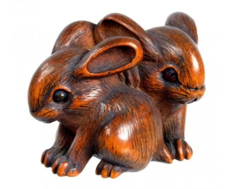 A JAPANESE BOXWOOD NETSUKE OF LEVERETS, EDO PERIOD, 19TH C unsigned,  4cm l ++In fine condition and good patina with old accr