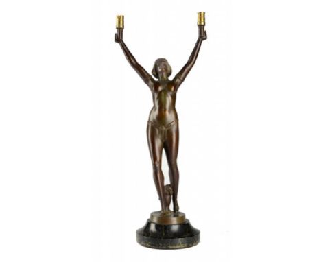 AN ART DECO  PATINATED SPELTER LAMP IN THE FORM OF A BIKINI DANCER ON TURNED SERPENTINE PLINTH, C1930, 51cm h excluding bulb 