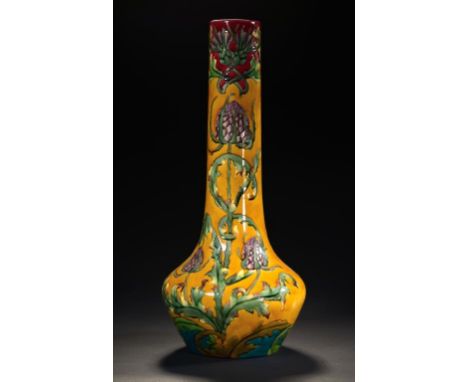 A LONGWY MAJOLICA VASE, C1900  of bottle shape, slip trailed with flowers on an ochre glazed ground, 59cm h, impressed mark a