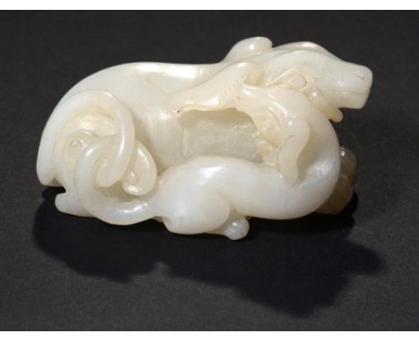 A CHINESE WHITE JADE PEBBLE CARVING OF TWO DOGS 7.7cm ++In good condition 