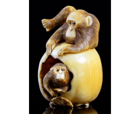 A JAPANESE IVORY NETSUKE OF TWO MONKEYS WITH A PERSIMMON FRUIT, SIGNED MASATAMI, NAGOYA SCHOOL, MEIJI PERIOD, LATE 19TH C the