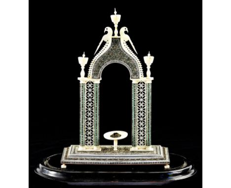 AN INDIAN IVORY, SANDALWOOD AND SADELI MODEL OF AN ARCH, MID 19TH C 29cm  h, on ebonised wood base beneath glass dome  ++Some