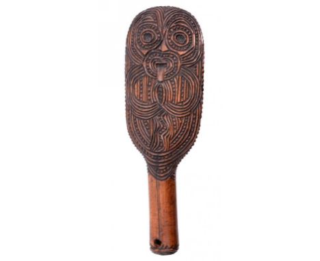 A MAORI WOOD CLUB, EARLY 20TH C carved on both faces with a grotesque mask, 25cm ++Only one of the four mother of pearl inset