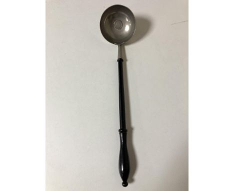 A toddy ladle with inset coin   