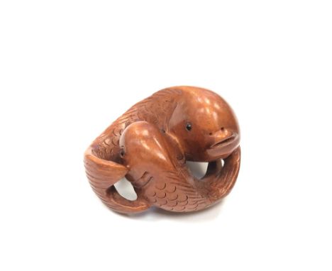 A Chinese hardwood netsuke - Two Carp. 