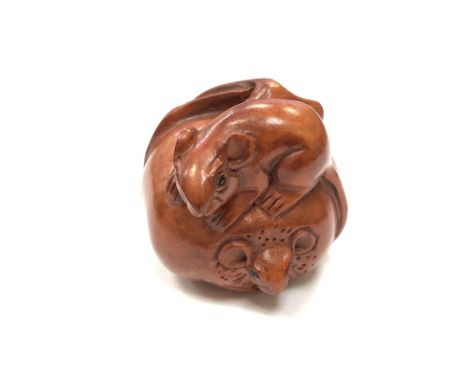 A Chinese hardwood netsuke - A Rat on a Pumpkin. 