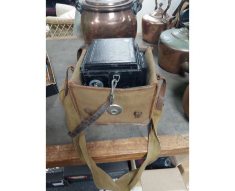 A Salex Reflex camera in canvas carry bag 