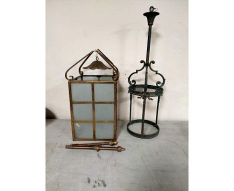 An early 20th century brass hanging hall lantern with frosted glass panels together with a further circular pendant light fit