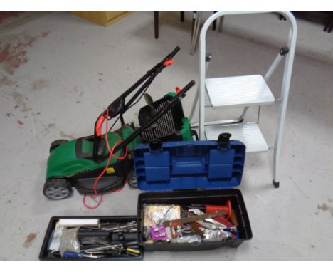 A Qualcast electric lawn mower together with a folding metal step and a toolbox with contents 