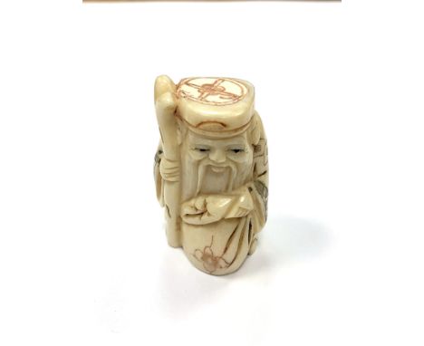 A Chinese bone netsuke - A Bearded Man with Sack. 