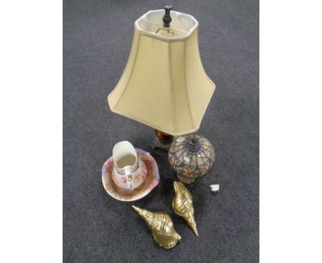 A Tiffany style table lamp with leaded glass shade together with a further table lamp and shade, a pair of gilt shell ornamen