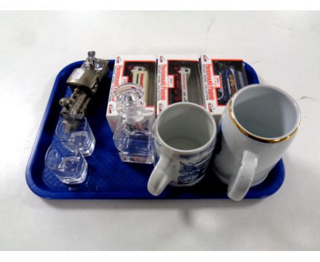 A tray containing an Aberdeen University miniature decanter with two shot glasses, two china tankards, three boxed Fisherman'