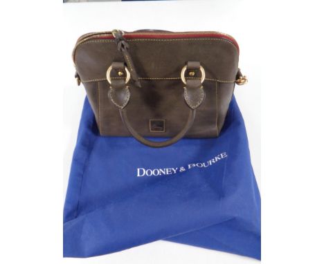 A lady's Dooney and Bourke Italian leather handbag with protective carrying bag  