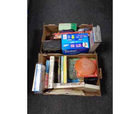 Two boxes containing vintage camera, Snoopy calendars, jigsaw puzzles, ziplock bags, tablet cases, kindle etc 