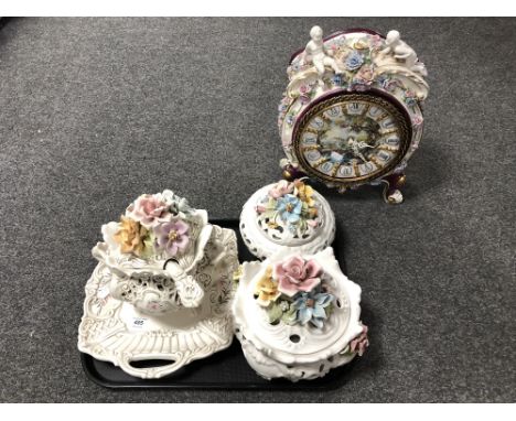 A tray of 20th century continental encrusted porcelain together with a similar circular porcelain mantle clock with battery m