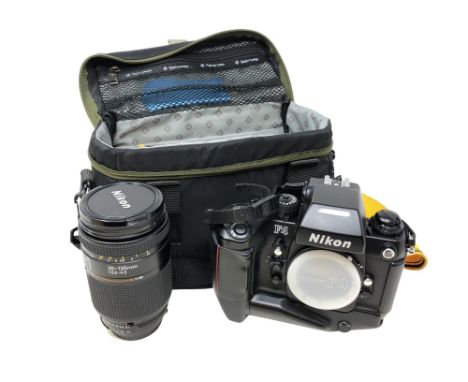 A Nikon F4 camera body numbered 2244123, in carry bag together with a Nikon AF Nikkor 35-135mm lens, also with box for lens. 