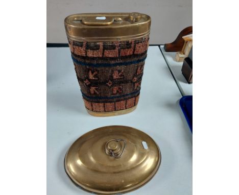 A Victorian brass hot water bottle with Persian carpet covering together with a further brass container 