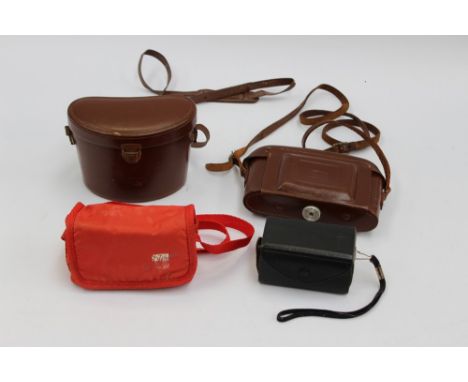 An Instamatic camera, Fuiji camera, a Carl Zeiss, cased pair of binoculars and  Zeiss Ikon Nettar camera 