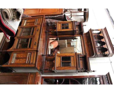 A late Victorian rosewood and marquetry inlaid chiffonier, mirror backed, the upper section with a gallery top and glazed doo