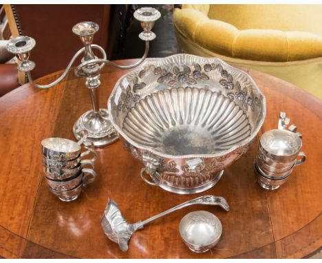 A silver plate on copper footed punch bowl with matching punch ladle and twelve matching punch cups, also including EPNS cand