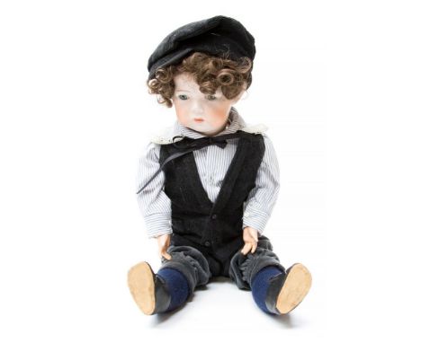 Kammer & Reinhardt: A Kammer & Reinhardt bisque head boy doll, jointed limbs, blue glass eyes, stamped to the back of the nec
