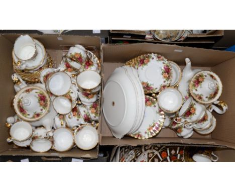 Two boxes of Royal Albert 'Old Country Roses' part tea wares, including two teapots, four cake plates, cups, saucers, etc 