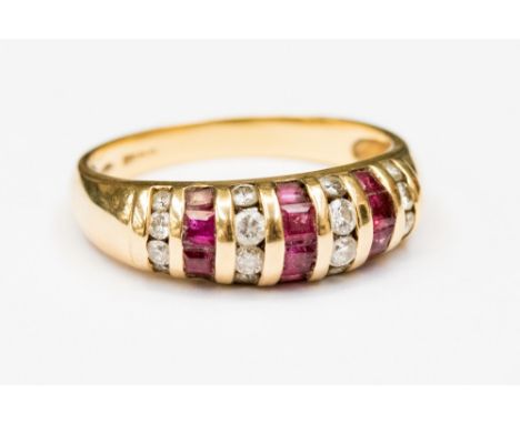 An 18ct gold, diamond and ruby ring, set with alternate side by side rows of square rubies and brilliant cut diamonds, size P