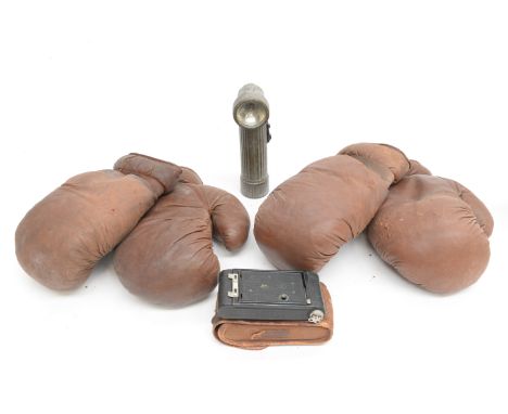 A wartime touch,  black cased camera with canvas case, plus a collection of boxing gloves (6 pieces)