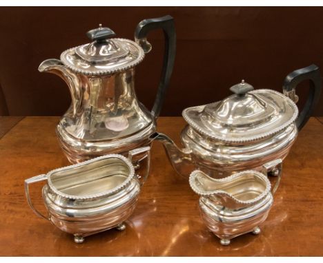 A collection, matching set of silver pieces to include a teapot, coffee pot, cream jug and sugar bowl with ebony handles and 