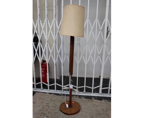 A 1950s teak standard lamp, with shadeThis item has PASSED its PAT test