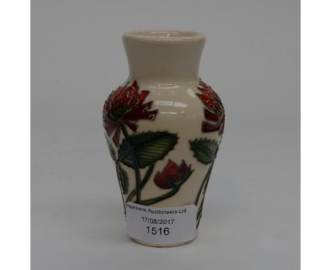 A Moorcroft 1st quality vase in the trefoil pattern, in unusual colourway, red clover flowers on cream ground, designed by Ni
