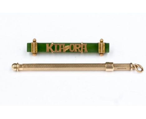 A 9ct gold swizzle stick, weighing approx 5.7 gms; together with a jade and gold 'Kia Ora' bar brooch 2