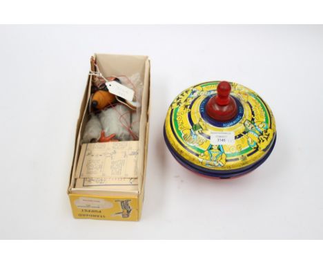 A boxed Pelham Wombles puppet, and a tinplate Chad Valley Humming Top (2)