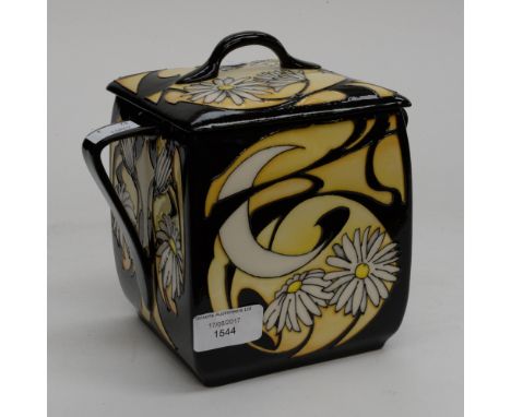 A Moorcroft design trail twin handled biscuit box with cover, black ground with Art Deco style and Daisy pattern, 1st quality