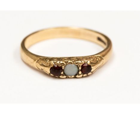 A 9ct gold, garnet and opal ring, set with a central opal and two garnets,  size O½  with a total gross weight approx 2.7gms