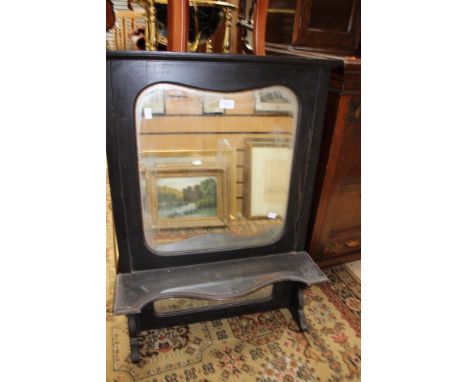 A Victorian over mantle mirror, in an ebonised frame, of two sections