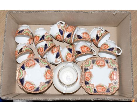 An early 20th century tea set, stamped to base, 'Bell China' comprising 12 cups, 11 saucers, 9 side plates, milk jug and suga