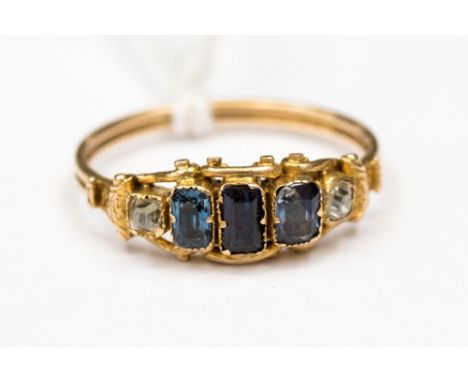 A 19th Century sapphire and diamond ring, circa 1820 or later, set in gold possibly 18ct, set with three unmatched rectangula