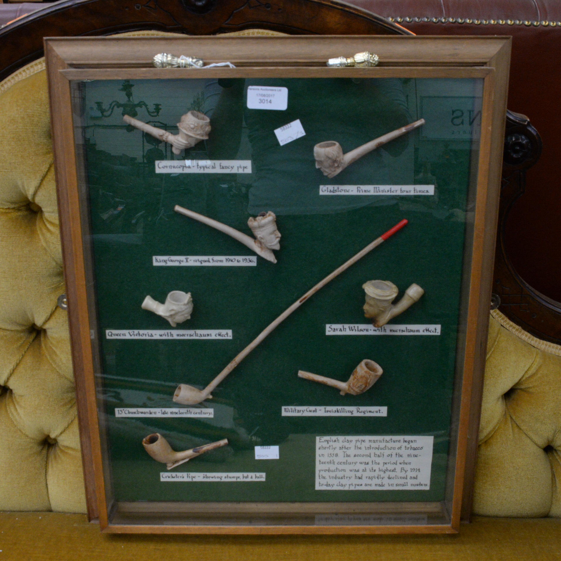 A well presented framed collection of eight reproduction English clay