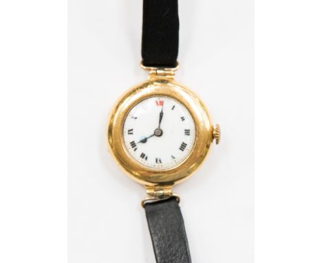A 1930s ladies 18ct gold wristwatch, white enamel dial with black and red Roman numerals