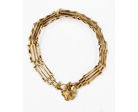 A 9ct gold multi row gate bracelet with padlock clasp and safety chain, with a weight of  5.3 grams approx 