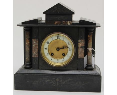 A slate mantle clock, with marble pillars, Arabic numerals, key and pendulum
