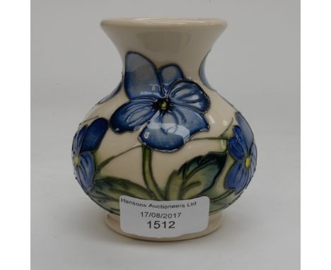 A squat bulbous Moorcroft vase, pansy/violas pattern, having blue flowers on cream ground, 1st quality, dated to the base Jun