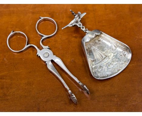 A pair of 18th century silver sugar tongs, scissor action, circa 1745, marked; together with a Dutch silver caddy spoon (2) 