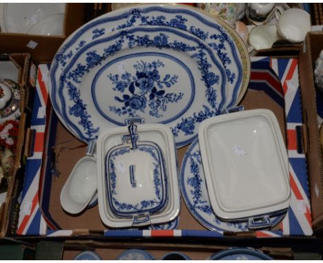 A blue and white part dinner service, including two chargers, three servers and covers, sauce ladle, five plates, gravy boat 