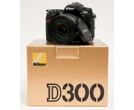 Nikon: A boxed Nikon D300 SLR camera body, complete with lens, Nikkor 24-120mm, 1:3.5-5.6D.