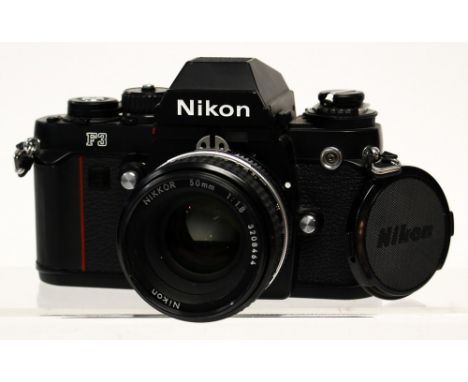 Nikon: A Nikon F3 SLR camera body, black, shutter in working order, appears good, complete with lens, Nikkor 50mm, 1:1.8, 320