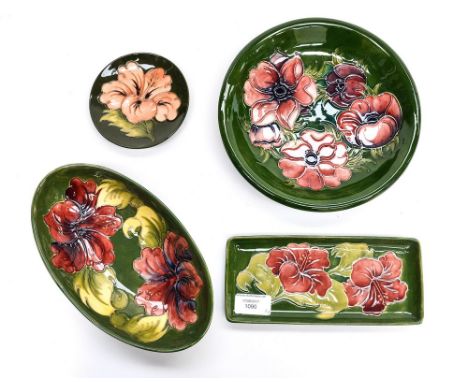 Four Moorcroft bowls and trinket dishes, all having green ground